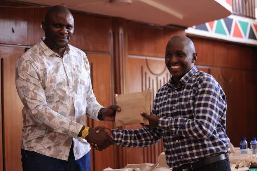 MCA reviewing bursary cheques